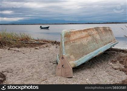 An old boat abandoned by the beach