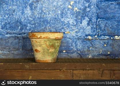 An Old Clay Plant Pot In A Potting Shed