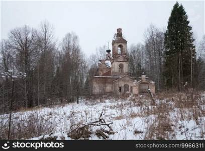 An old dilapidated church in the woods in winter. crumbling buildings.. old dilapidated church in the woods in winter. crumbling buildings.