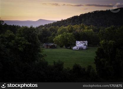 An old farmstead near Luray, Virginia during an evening sunset within the Shenandoah Valley.