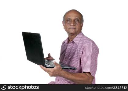 an old Indian man surfing the net after retirement
