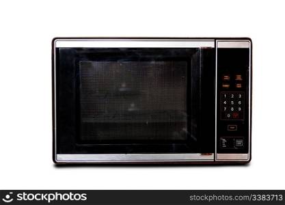 An old microwave isolated on white