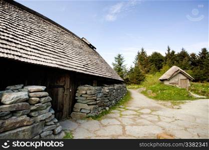 An old norwegian viking farm with two typical buildings