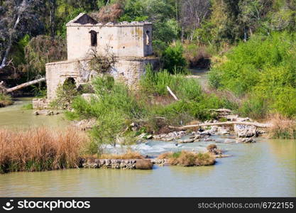 An old ruined Arab water mill on the scenic Guadalquivir river in Cordoba, Andalusia, Spain.