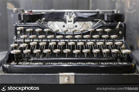 An old standard portable typewriter with metal edging of keys