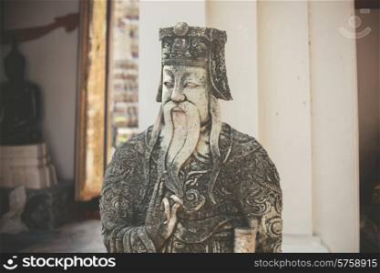 An old statue in a buddhist temple