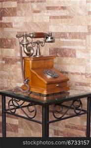 an old telephone, built in wood and metal