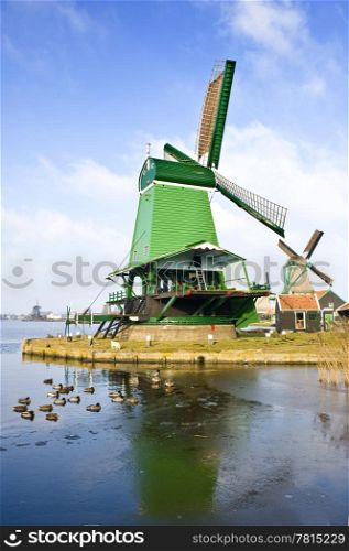 "An old, typically Dutch saw mill at the tourist attraction "De Zaanse Schans" on a nice winter day"