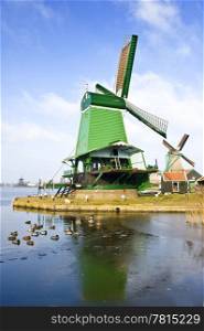 "An old, typically Dutch saw mill at the tourist attraction "De Zaanse Schans" on a nice winter day"