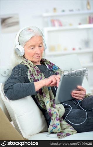 an old woman using tablet