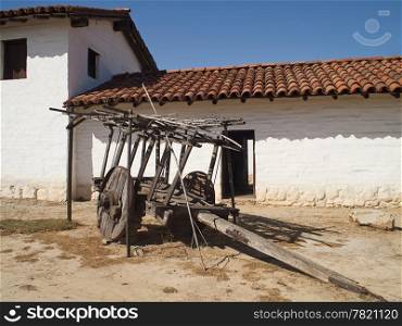 An old wood wagon in the courtyard of one of the old Santa Barbara mission buildings.