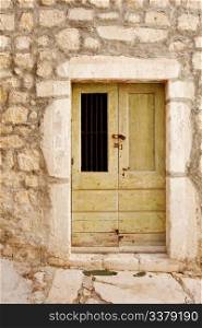 An old wooden door in a stone building