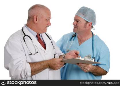 An older doctor instructs an intern as they discuss a patient&rsquo;s medical history. Isolated.