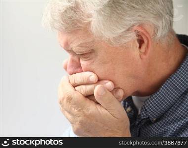 an older man getting ready to vomit
