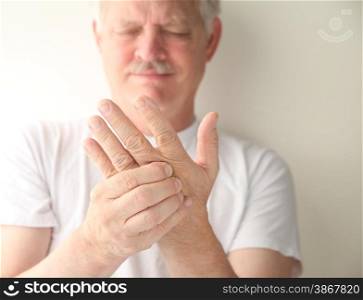 An older man has numbness and tingling in his hand.