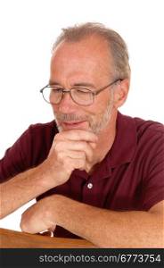 An older man sitting on a chair with his hand on his chin, thinking, withglasses, isolated for white background.