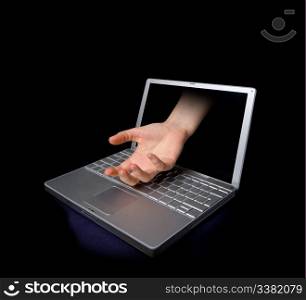 An open hand coming through a computer screen.