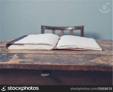 An open notebook on an old wooden desk