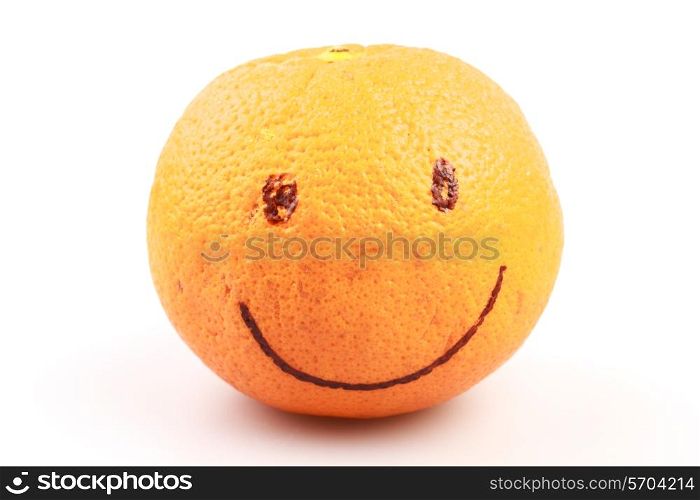 An orange with a smiling face drawn on it