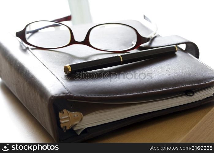 An organizer and a pair of glasses