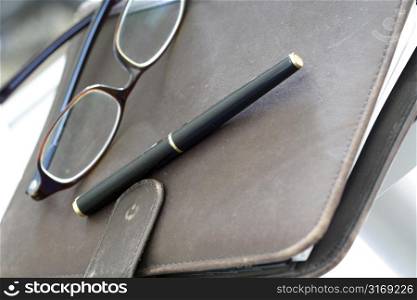 An organizer and a pair of glasses