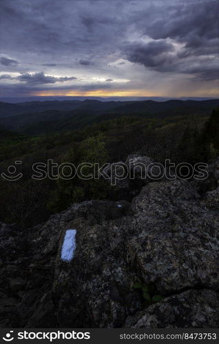 An overcast and stormy spring evening from Bearfence Mountain in Shenandoah National Park, Virginia.