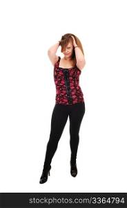 An pretty blond woman in black tights and a red black vest and high heelsstanding in the studio, for white background.