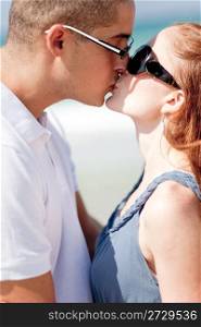 An Romantic couple kissing on the beach,madly in love