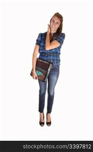An tall teenager with her notebook, in jean and a blue chickened blouse,standing for white background in the studio.