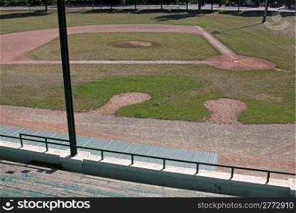 An unoccupied baseball field featuring on deck circles, shot from the bleachers.. On Deck Circles