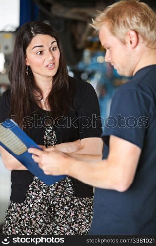 An upset female customer at a mechanic shop