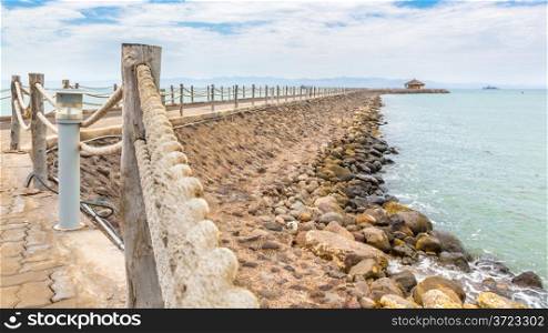 An walkway fenced with rope along the shores of the Red sea near Djibouti port