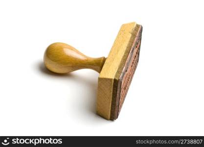 An wooden rubber stamp isolated on white background