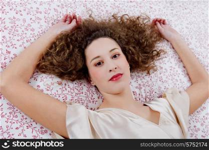 an young beautiful sensual woman in bed