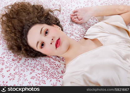 an young beautiful sensual woman in bed