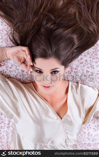 an young beautiful sensual woman in bed