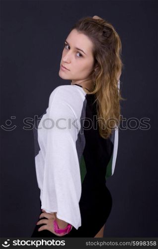an young beautiful woman portrait on a black background