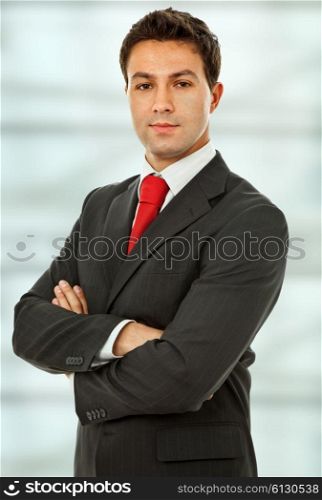 an young business man portrait at the office