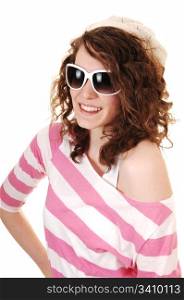 An young happy woman in a striped sweater a knitted hat and sunglasses standing for white background.