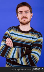 an young man portrait over a blue background