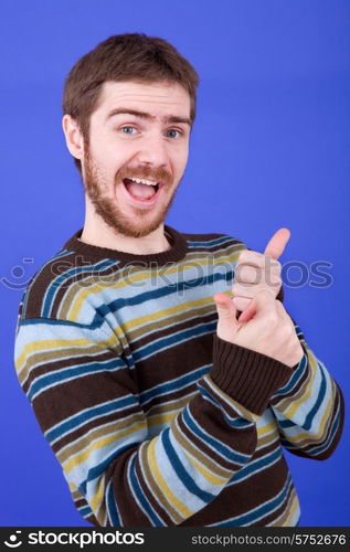 an young man portrait over a blue background