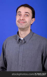 an young man portrait over a blue background