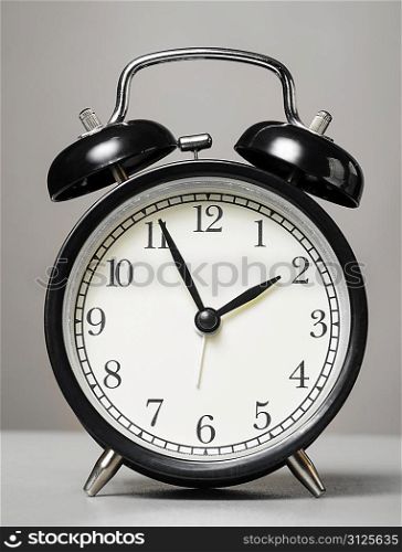 analog alarm clock on white background