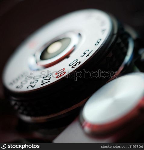 Analog film camera top view with a shutter dial set to aperture priority. Shutter speed dial.