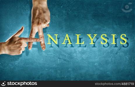 Analysis in marketing. Close up of hands making letter a in analysis word