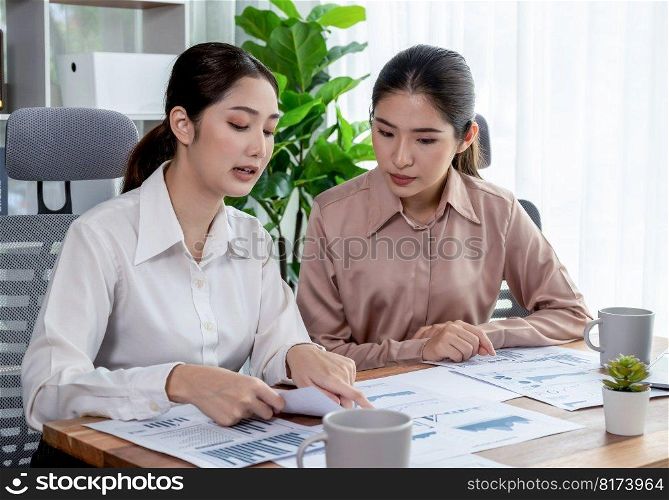 Analyst team colleagues discuss financial data on digital dashboard, analyzing charts and graph with supportive teamwork. Professional office use business intelligence to plan marketing. Enthusiastic. Analyst team colleague discuss financial data on digital dashboard. Enthusiastic