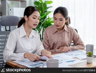Analyst team colleagues discuss financial data on digital dashboard, analyzing charts and graph with supportive teamwork. Professional office use business intelligence to plan marketing. Enthusiastic. Analyst team colleague discuss financial data on digital dashboard. Enthusiastic