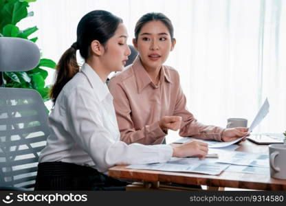 Analyst team colleagues discuss financial data on digital dashboard, analyzing charts and graph with supportive teamwork. Professional office use business intelligence to plan marketing. Enthusiastic. Analyst team colleague discuss financial data on digital dashboard. Enthusiastic