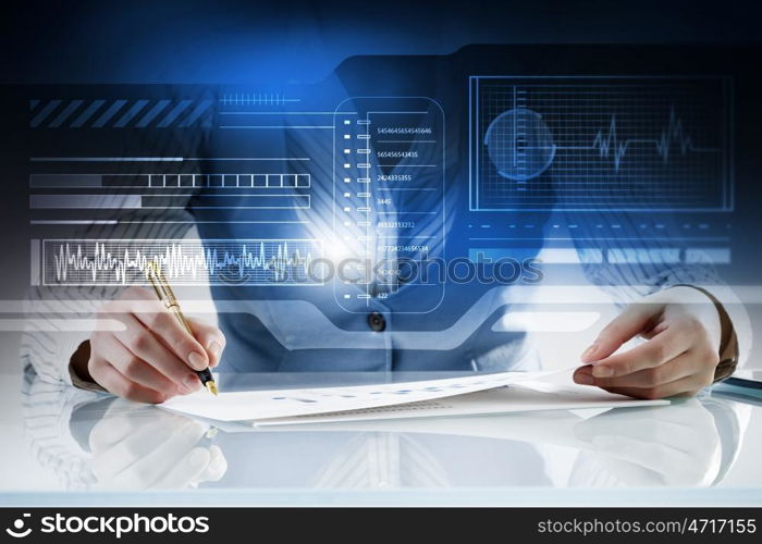 Analyzing statistics data. Close view of businesswoman working with papers at table