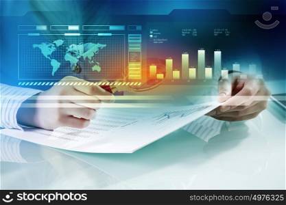 Analyzing statistics data. Close view of businesswoman working with papers at table
